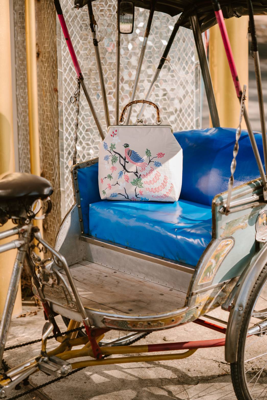 KAMONMANEE Peacock Batik Bamboo Bag on a rickshaw